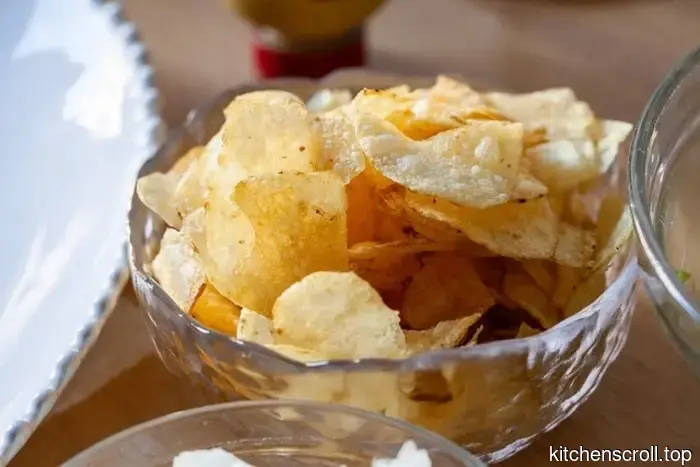 hot dogs served with pickled iceberg lettuce and potato chips