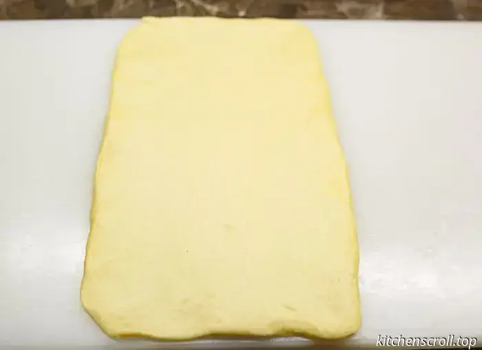 Bollo dulce en espiral con relleno de chocolate y nueces en el Blog Delicioso.